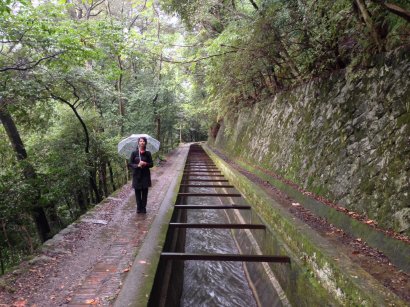 Walking beside old canal above the city